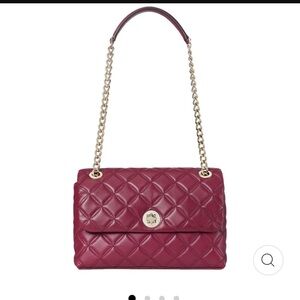 Kate Spade Natalia shoulder bag in blackberry preserve with gold hardware.